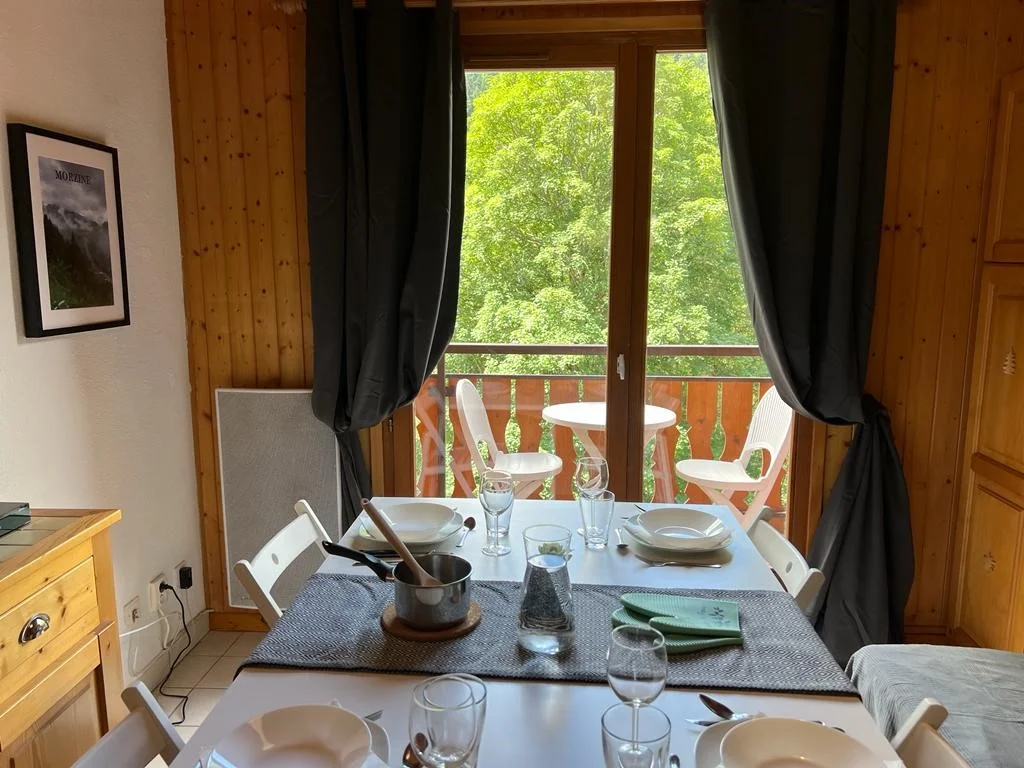 Table laid for 4 facing the balcony