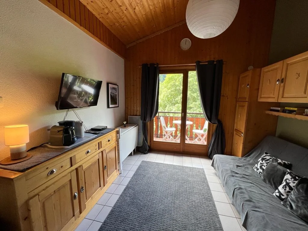 Bright living area with French window onto the balcony